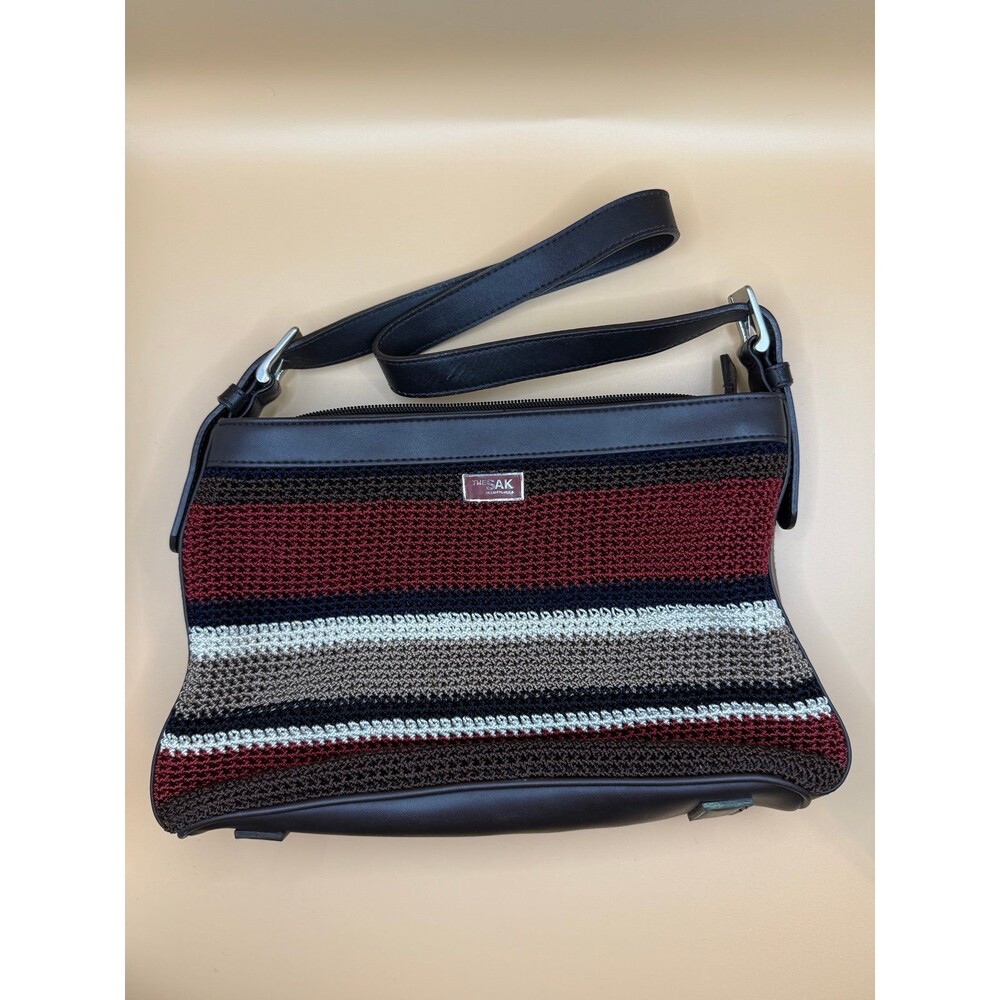 The Sak Elliott Lucca crochet shoulder bag with a multi-color striped pattern an